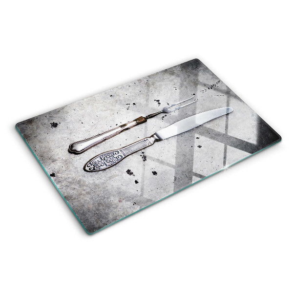 Schneidebrett Besteck auf Betongrund