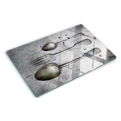 Schneidebrett glas Besteck auf Betongrund