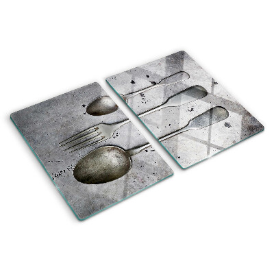 Schneidebrett glas Besteck auf Betongrund