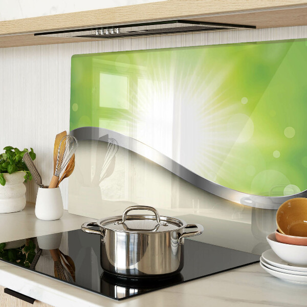 Glas schneidebrett mit grünem Bokeh-Motiv und Lichtstrahlen