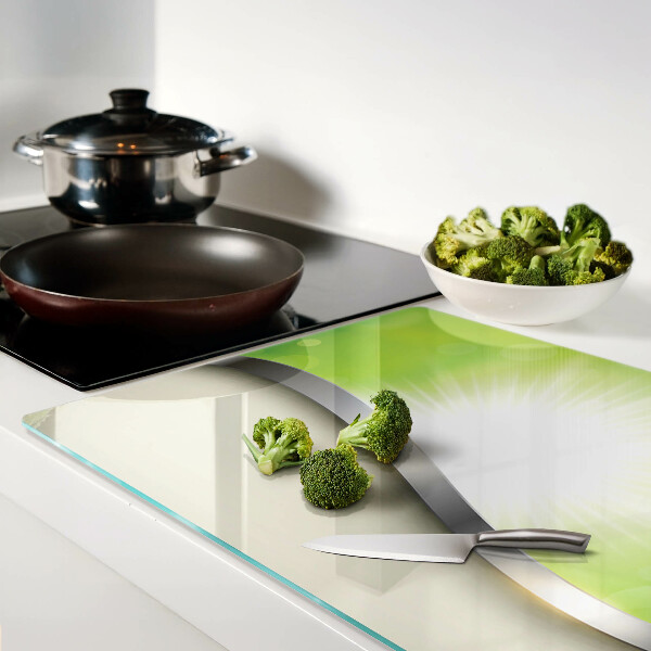 Glas schneidebrett mit grünem Bokeh-Motiv und Lichtstrahlen