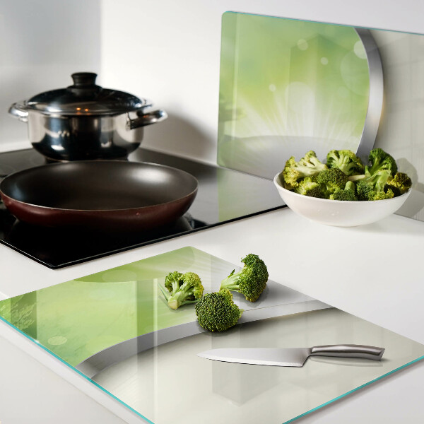 Glas schneidebrett mit grünem Bokeh-Motiv und Lichtstrahlen