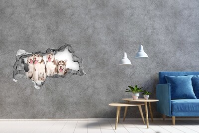 Mauerdurchbruch Aufkleber Huskywelpen hinter einem Loch in der Wand