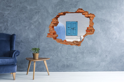 Wandtattoos Loch Eine zerbrochene Mauer mit einer blauen Tür