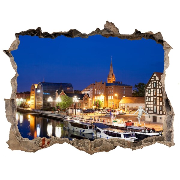 Wandfolien Loch in der Wand Nachtansicht der Stadt am Fluss