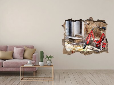 Wandfolien Loch in der Wand Ein rotes Fahrrad in einer charmanten Straße