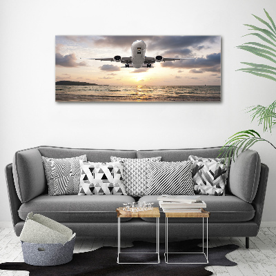 Acrylglas-Druck Ein Flugzeug über dem Meer