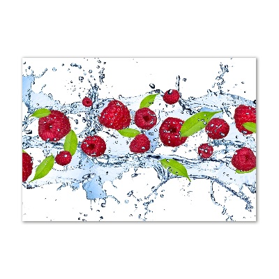Bild auf Acrylglas Himbeeren und Wasser