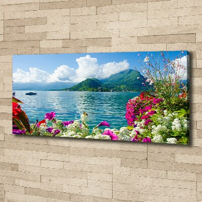 Bild auf leinwand Blumen am See