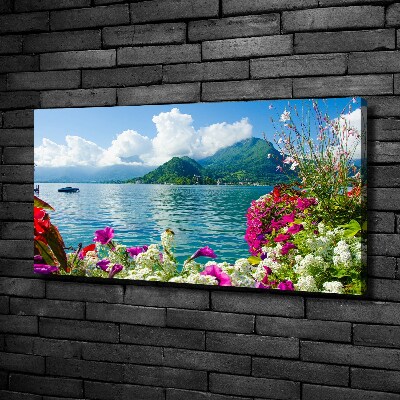 Bild auf leinwand Blumen am See
