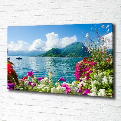 Bild auf leinwand Blumen am See