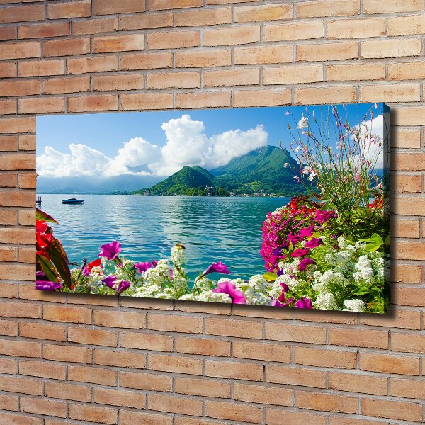 Bild auf leinwand Blumen am See
