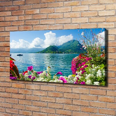 Bild auf leinwand Blumen am See