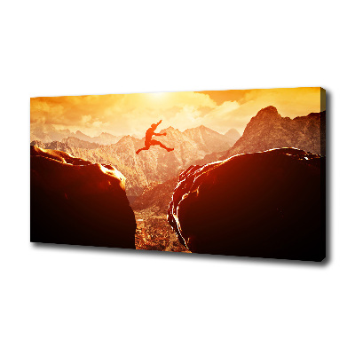 Wandbild Spring über den Abgrund