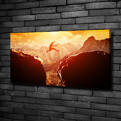 Wandbild Spring über den Abgrund