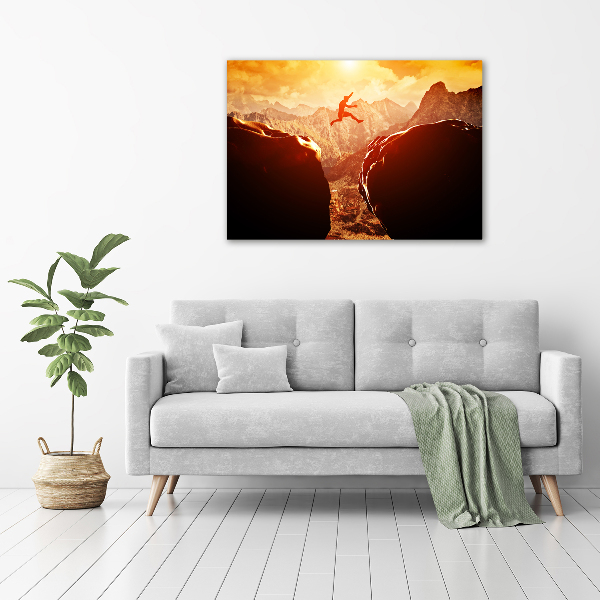 Wandbild Spring über den Abgrund