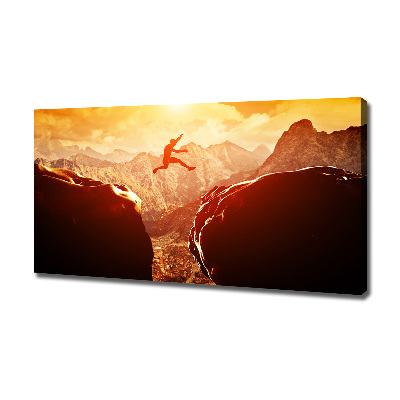 Wandbild Spring über den Abgrund