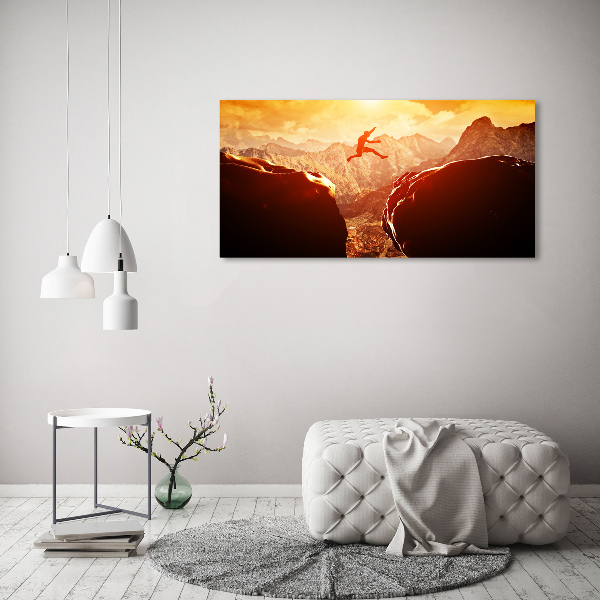 Wandbild Spring über den Abgrund