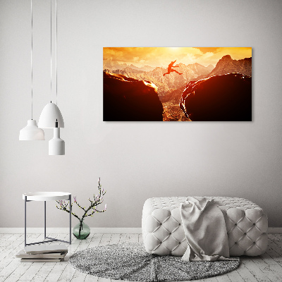 Wandbild Spring über den Abgrund