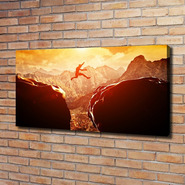 Wandbild Spring über den Abgrund