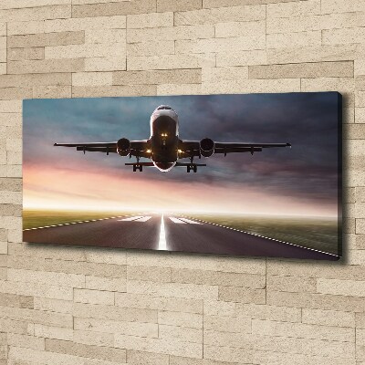 Wandbild Ein Flugzeug startet