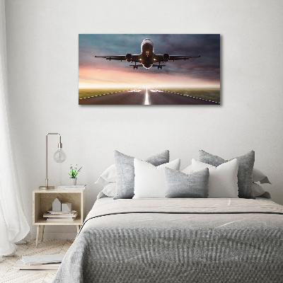 Wandbild Ein Flugzeug startet