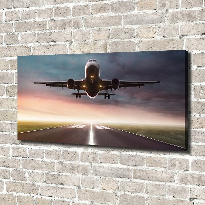 Wandbild Ein Flugzeug startet