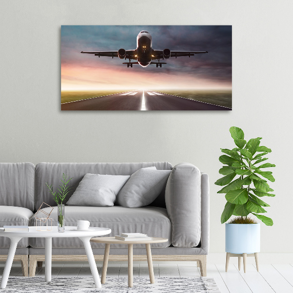 Wandbild Ein Flugzeug startet
