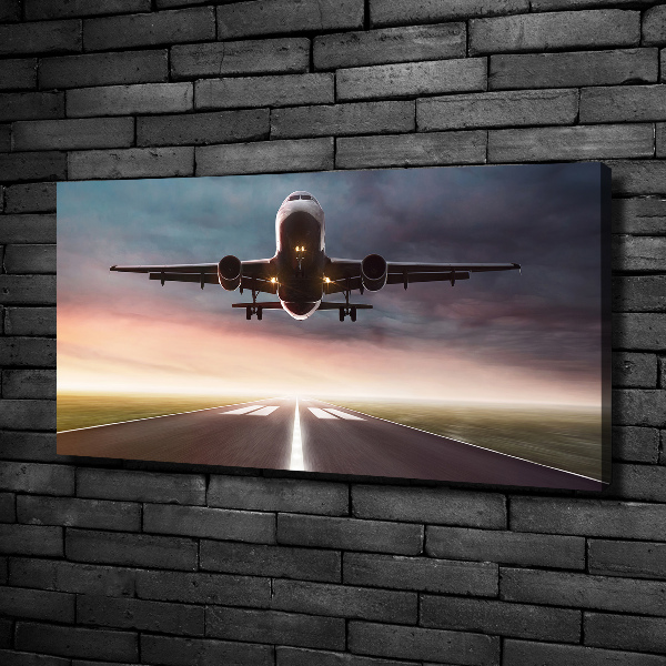 Wandbild Ein Flugzeug startet