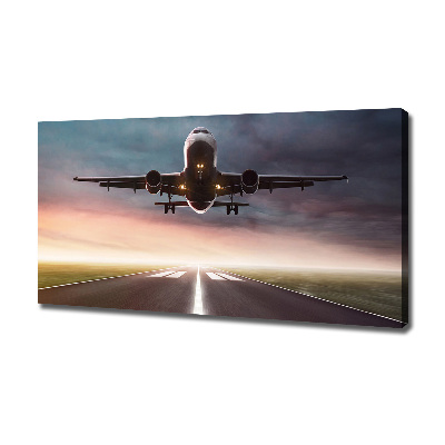 Wandbild Ein Flugzeug startet