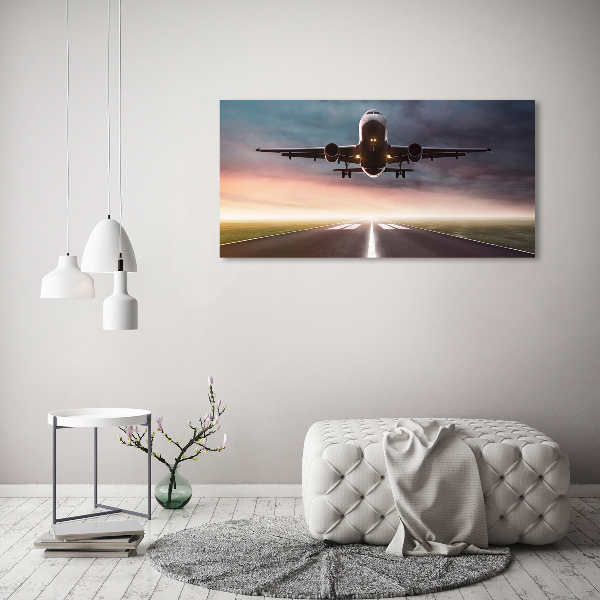 Wandbild Ein Flugzeug startet