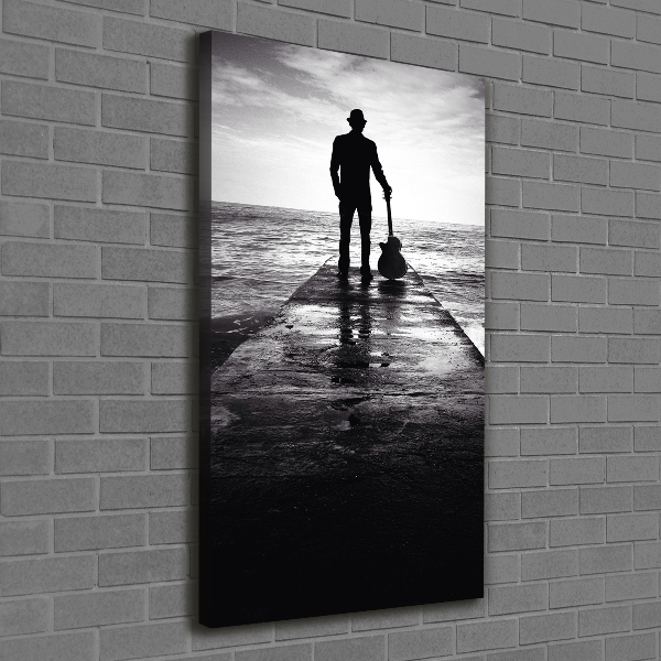 Foto auf leinwand vertikales Gitarrist auf dem Pier
