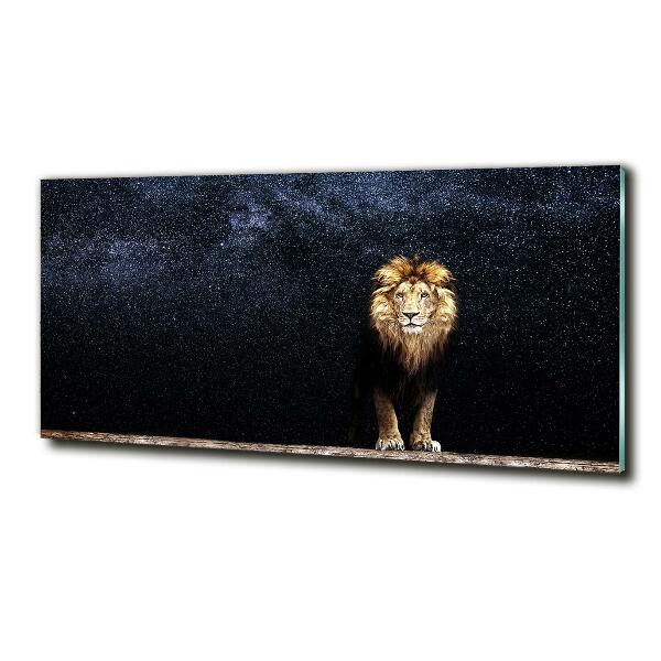 Glasbild Löwe gegen die Sterne