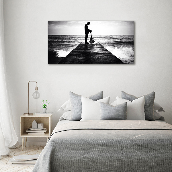 Glasbild Gitarrist auf dem Pier