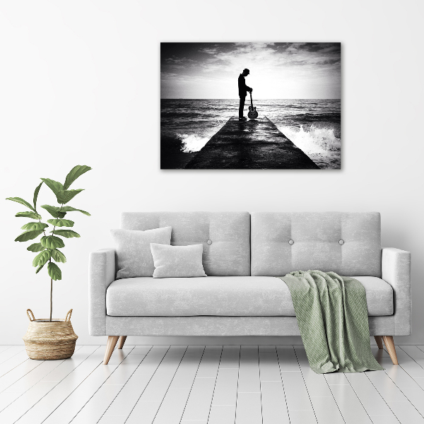 Glasbild Gitarrist auf dem Pier