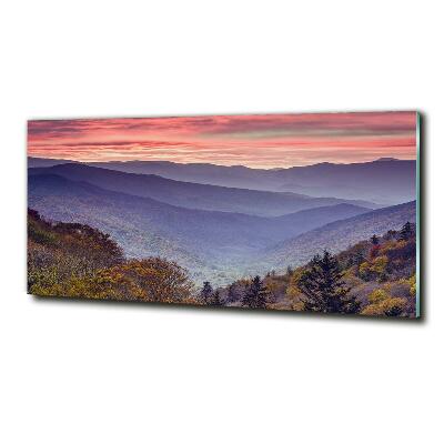 Foto glasbild Sonnenuntergang in den Bergen