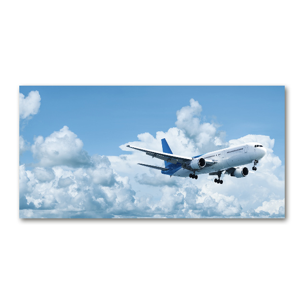 Glasbild Ein Flugzeug am Himmel