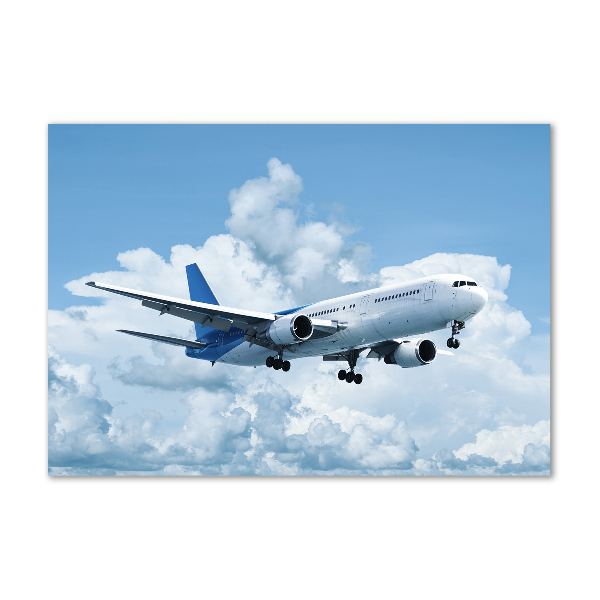 Glasbild Ein Flugzeug am Himmel