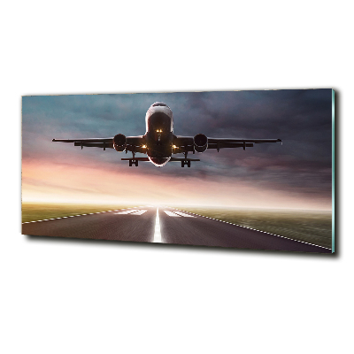 Glasbild Ein Flugzeug startet