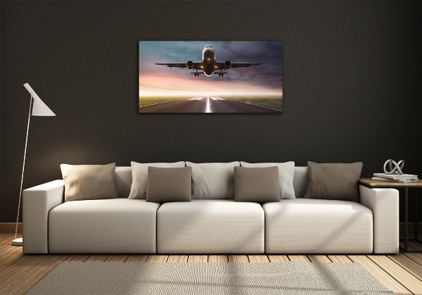 Glasbild Ein Flugzeug startet