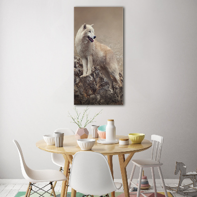Glasbild vertikales Wolf auf einem Felsen