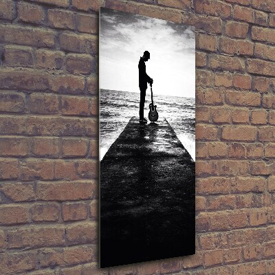 Foto auf glas vertikales Gitarrist auf dem Pier