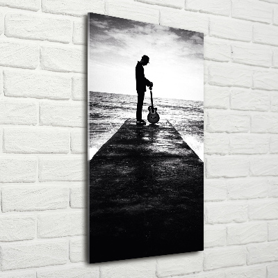 Foto auf glas vertikales Gitarrist auf dem Pier
