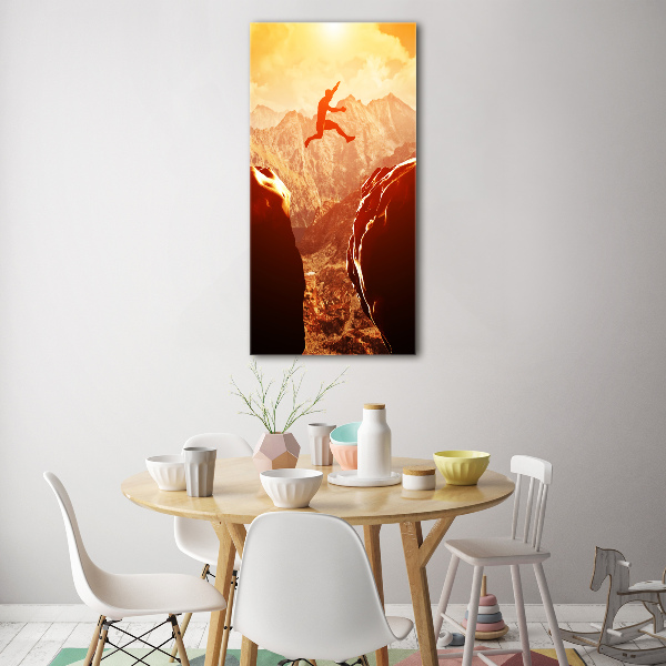 Foto auf glas vertikales Spring über den Abgrund