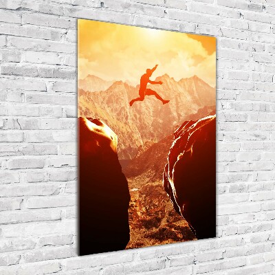 Foto auf glas vertikales Spring über den Abgrund
