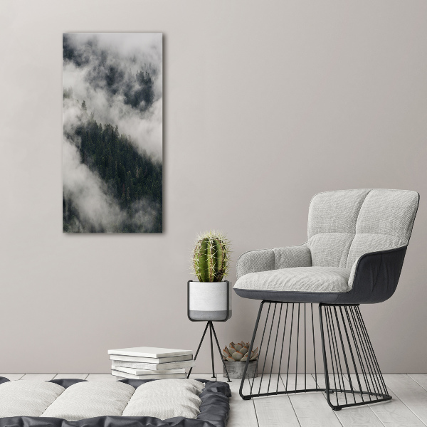 Glasbild vertikales Eine Wolke über dem Wald