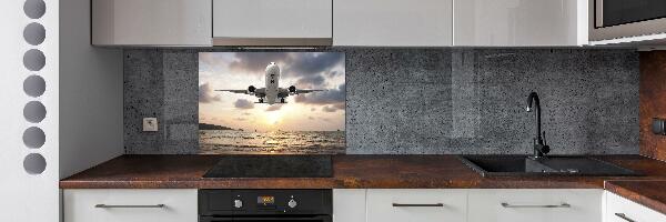 Platte für Küchenrückwand Ein Flugzeug über dem Meer