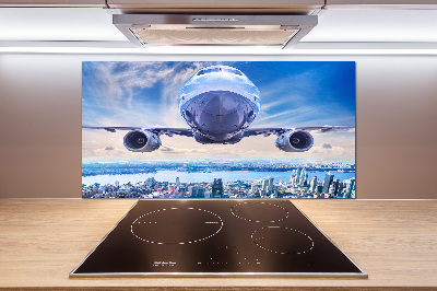 Küchen wandpaneel Ein Flugzeug über der Stadt