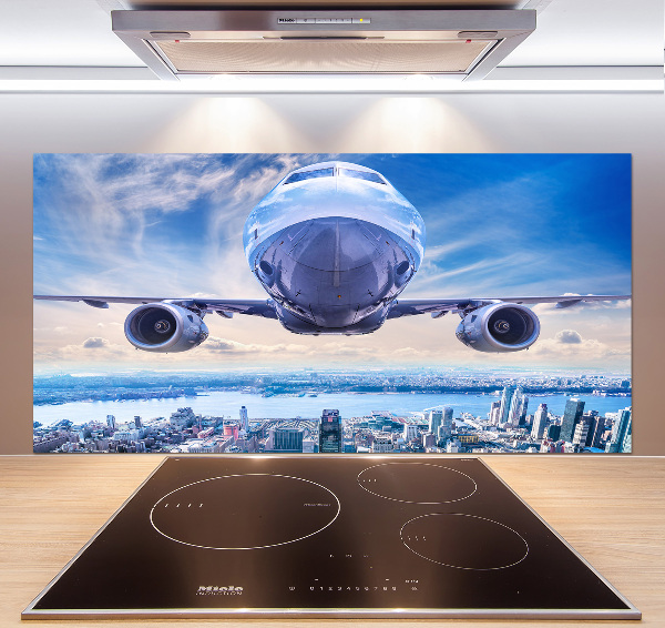 Küchen wandpaneel Ein Flugzeug über der Stadt