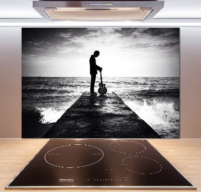 Glasrückwand für die küche Gitarrist auf dem Pier